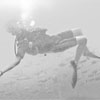 Student diver swimming backwards